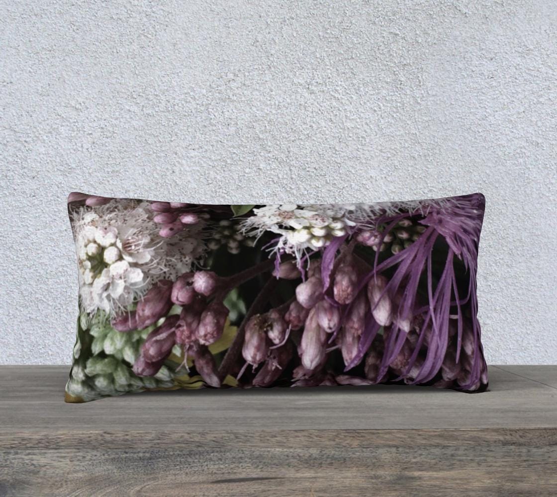 Bed of Flowers accent pillow case featuring white starburst flowers, purple hyacinth buds, deep violet leaves, and pale green flower clusters on black background